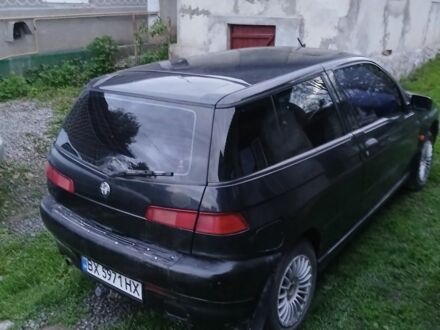 Черный Альфа 145, объемом двигателя 1.4 л и пробегом 300 тыс. км за 1750 $, фото 1 на Automoto.ua