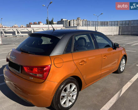 Ауді А1 2013 у Києві на Automoto.ua Помаранчевий Ауді А1, об'ємом двигуна 1.6 л та пробігом 141 тис. км за 13900 $, фото 3 на Automoto.ua
