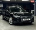 Черный Ауди А4, объемом двигателя 1.98 л и пробегом 144 тыс. км за 15500 $, фото 1 на Automoto.ua