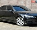 Черный Ауди А4, объемом двигателя 2 л и пробегом 140 тыс. км за 18499 $, фото 1 на Automoto.ua