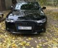 Черный Ауди А6, объемом двигателя 2 л и пробегом 230 тыс. км за 14600 $, фото 1 на Automoto.ua