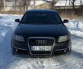 Черный Ауди А6, объемом двигателя 2.4 л и пробегом 300 тыс. км за 5000 $, фото 1 на Automoto.ua