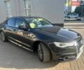 Черный Ауди А6, объемом двигателя 2 л и пробегом 235 тыс. км за 12900 $, фото 1 на Automoto.ua