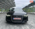 Черный Ауди А6, объемом двигателя 2 л и пробегом 220 тыс. км за 11800 $, фото 1 на Automoto.ua