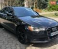 Черный Ауди А6, объемом двигателя 2 л и пробегом 200 тыс. км за 14500 $, фото 1 на Automoto.ua