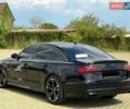 Черный Ауди А6, объемом двигателя 2 л и пробегом 135 тыс. км за 19999 $, фото 1 на Automoto.ua