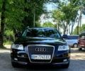Черный Ауди А6, объемом двигателя 2 л и пробегом 310 тыс. км за 12300 $, фото 1 на Automoto.ua