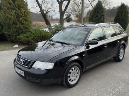 Черный Ауди А6, объемом двигателя 1.8 л и пробегом 300 тыс. км за 1750 $, фото 1 на Automoto.ua