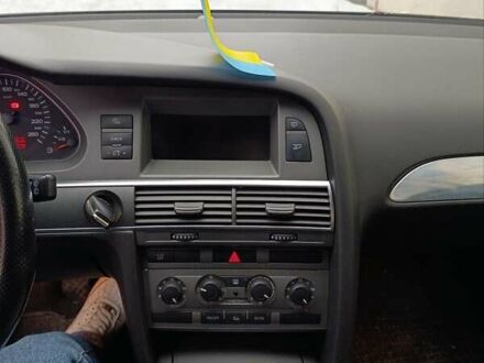 Черный Ауди А6, объемом двигателя 1.98 л и пробегом 252 тыс. км за 6450 $, фото 1 на Automoto.ua