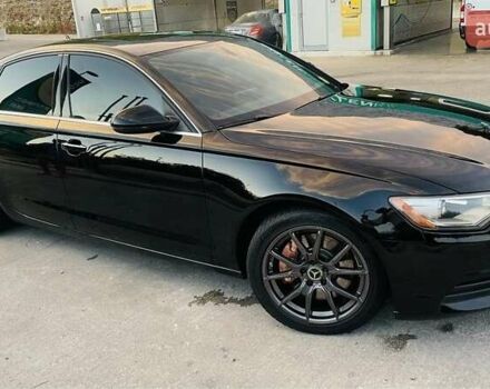 Черный Ауди А6, объемом двигателя 2 л и пробегом 165 тыс. км за 14600 $, фото 1 на Automoto.ua