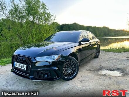 Чорний Ауді А6, об'ємом двигуна 2 л та пробігом 143 тис. км за 19900 $, фото 1 на Automoto.ua