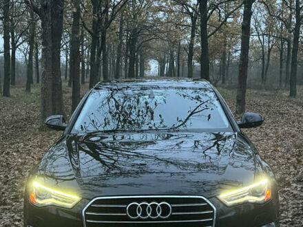 Черный Ауди А6, объемом двигателя 2 л и пробегом 143 тыс. км за 25000 $, фото 1 на Automoto.ua