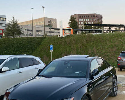 Черный Ауди С6, объемом двигателя 4 л и пробегом 122 тыс. км за 18800 $, фото 1 на Automoto.ua