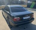 Черный БМВ 5 Серия, объемом двигателя 2.5 л и пробегом 401 тыс. км за 6550 $, фото 1 на Automoto.ua