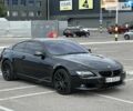 Черный БМВ 6 Серия, объемом двигателя 4.4 л и пробегом 105 тыс. км за 12800 $, фото 1 на Automoto.ua