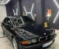 Черный БМВ 7 Серия, объемом двигателя 4.4 л и пробегом 400 тыс. км за 15000 $, фото 1 на Automoto.ua