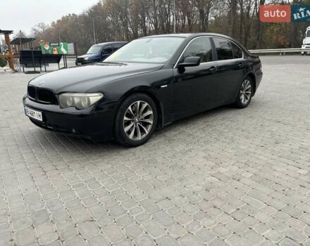 Черный БМВ 7 Серия, объемом двигателя 4.4 л и пробегом 265 тыс. км за 7800 $, фото 1 на Automoto.ua