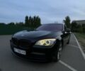 Черный БМВ 7 Серия, объемом двигателя 4.4 л и пробегом 350 тыс. км за 18500 $, фото 1 на Automoto.ua