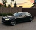 Черный БМВ 7 Серия, объемом двигателя 3 л и пробегом 238 тыс. км за 14200 $, фото 1 на Automoto.ua