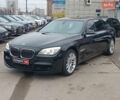 Черный БМВ 7 Серия, объемом двигателя 3 л и пробегом 149 тыс. км за 16990 $, фото 1 на Automoto.ua