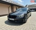 Черный БМВ 7 Серия, объемом двигателя 3 л и пробегом 95 тыс. км за 27500 $, фото 1 на Automoto.ua