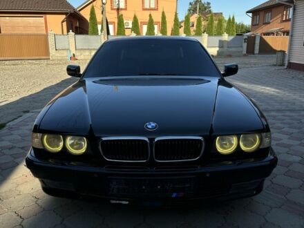 Черный БМВ 7 Серия, объемом двигателя 4.4 л и пробегом 300 тыс. км за 4950 $, фото 1 на Automoto.ua