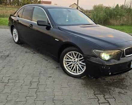 Черный БМВ 7 Серия, объемом двигателя 4.4 л и пробегом 300 тыс. км за 2999 $, фото 1 на Automoto.ua
