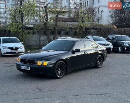 Черный БМВ 7 Серия, объемом двигателя 4.4 л и пробегом 408 тыс. км за 4950 $, фото 1 на Automoto.ua