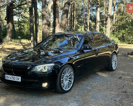 Черный БМВ 7 Серия, объемом двигателя 4.4 л и пробегом 180 тыс. км за 12000 $, фото 1 на Automoto.ua