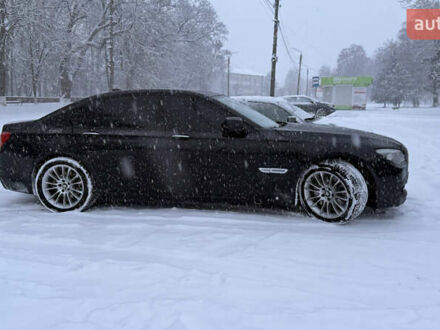 Чорний БМВ 7 Серія, об'ємом двигуна 3 л та пробігом 195 тис. км за 25000 $, фото 1 на Automoto.ua