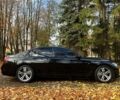 Черный БМВ 7-series, объемом двигателя 3 л и пробегом 182 тыс. км за 41300 $, фото 1 на Automoto.ua
