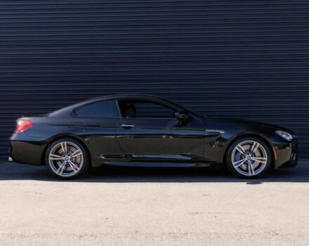 Черный БМВ М6, объемом двигателя 4.4 л и пробегом 77 тыс. км за 20500 $, фото 2 на Automoto.ua