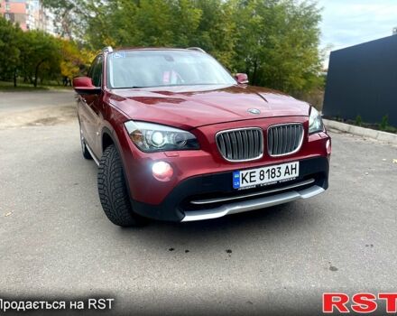 Красный БМВ Х1, объемом двигателя 2 л и пробегом 400 тыс. км за 12000 $, фото 1 на Automoto.ua