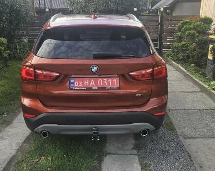 Оранжевый БМВ Х1, объемом двигателя 2 л и пробегом 65 тыс. км за 21600 $, фото 4 на Automoto.ua