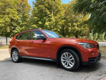 Оранжевый БМВ Х1, объемом двигателя 2 л и пробегом 236 тыс. км за 14000 $, фото 1 на Automoto.ua