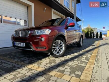Красный БМВ Х3, объемом двигателя 3 л и пробегом 104 тыс. км за 19700 $, фото 1 на Automoto.ua