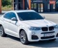 Белый БМВ Х4, объемом двигателя 2 л и пробегом 105 тыс. км за 25900 $, фото 1 на Automoto.ua