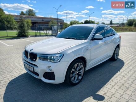Белый БМВ Х4, объемом двигателя 2 л и пробегом 105 тыс. км за 25900 $, фото 1 на Automoto.ua