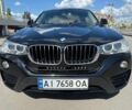 Черный БМВ Х4, объемом двигателя 2 л и пробегом 101 тыс. км за 19947 $, фото 1 на Automoto.ua