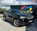 Чорний БМВ Х4, об'ємом двигуна 2 л та пробігом 96 тис. км за 18690 $, фото 1 на Automoto.ua