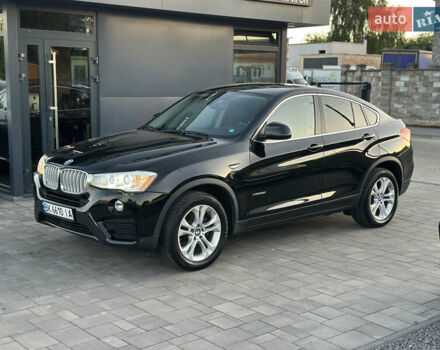 Черный БМВ Х4, объемом двигателя 2 л и пробегом 97 тыс. км за 19500 $, фото 1 на Automoto.ua