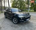 Черный БМВ Х4, объемом двигателя 2 л и пробегом 95 тыс. км за 26500 $, фото 1 на Automoto.ua