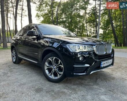Черный БМВ Х4, объемом двигателя 2 л и пробегом 95 тыс. км за 26500 $, фото 1 на Automoto.ua
