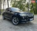 Черный БМВ Х4, объемом двигателя 2 л и пробегом 95 тыс. км за 26500 $, фото 1 на Automoto.ua