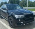 Черный БМВ Х4, объемом двигателя 2 л и пробегом 71 тыс. км за 28900 $, фото 1 на Automoto.ua