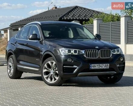 Черный БМВ Х4, объемом двигателя 2 л и пробегом 101 тыс. км за 27500 $, фото 1 на Automoto.ua