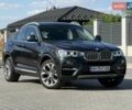 Черный БМВ Х4, объемом двигателя 2 л и пробегом 101 тыс. км за 27500 $, фото 1 на Automoto.ua