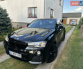 Черный БМВ Х4, объемом двигателя 2 л и пробегом 120 тыс. км за 24100 $, фото 1 на Automoto.ua