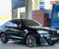 Черный БМВ Х4, объемом двигателя 2 л и пробегом 89 тыс. км за 30999 $, фото 1 на Automoto.ua