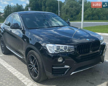 Черный БМВ Х4, объемом двигателя 2 л и пробегом 71 тыс. км за 29848 $, фото 1 на Automoto.ua